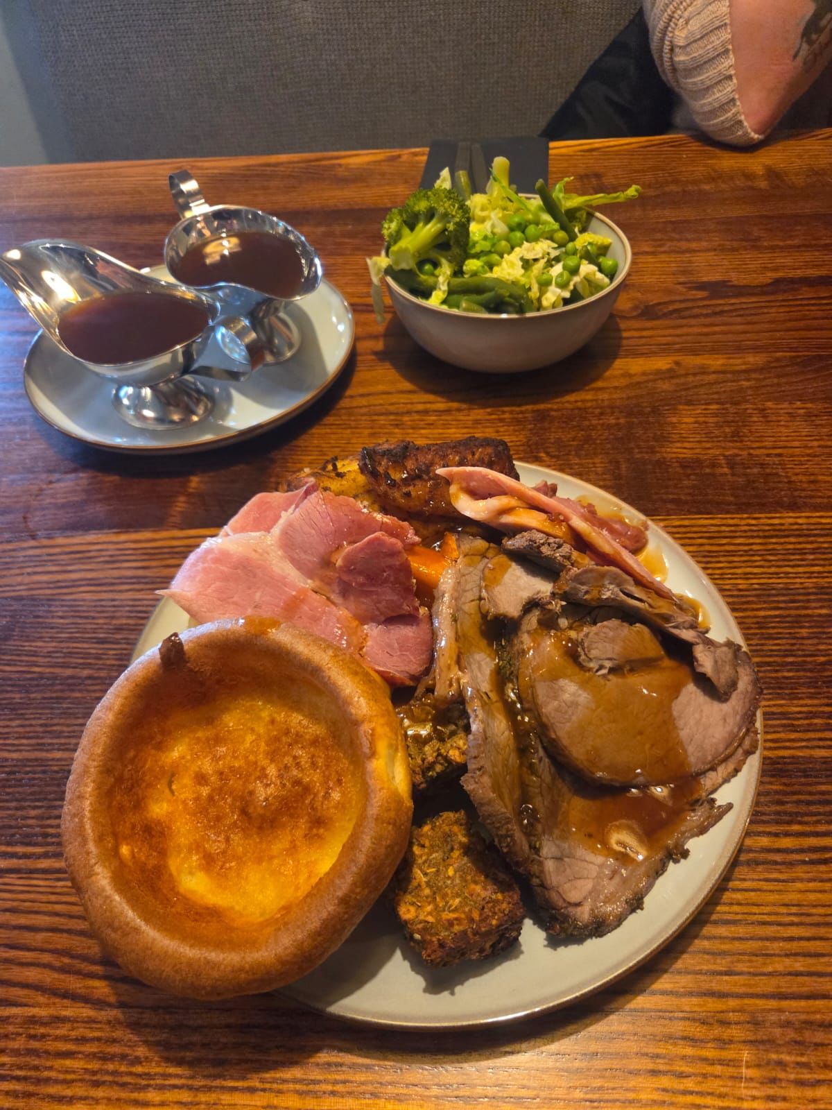Sunday roast plate with beef, gammon, Yorkshire pudding and gravy