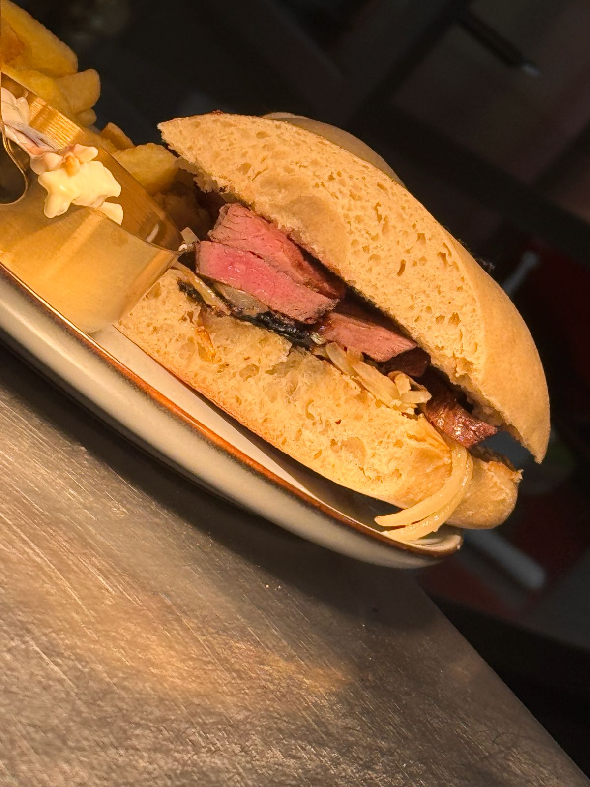 Steak ciabatta with caramelised onions and crisps